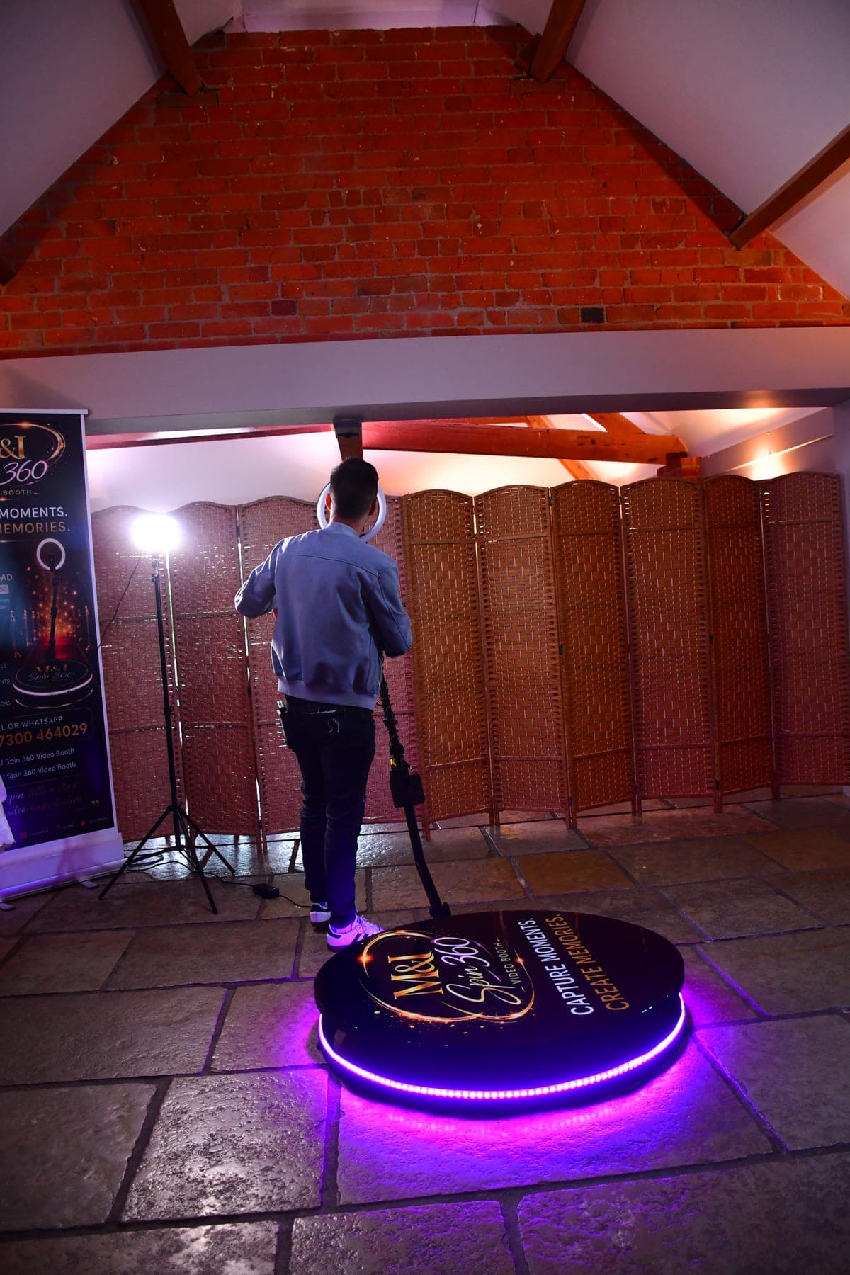 M&I Spin 360 360° video booth in use at a wedding
